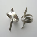 Pair of silver spiral earrings on a light gray background