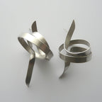 Pair of silver spiral earrings on a light gray background
