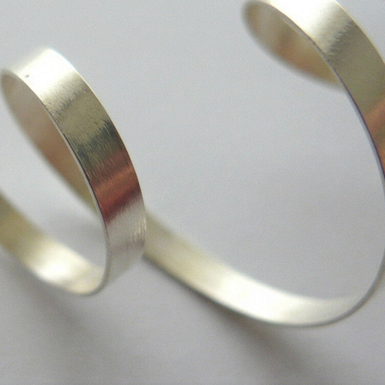 Gold spiral decorative elements on a white background